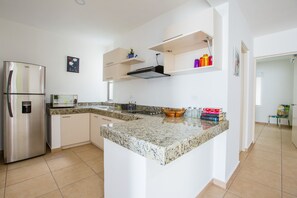 Fridge, microwave, stovetop, coffee/tea maker