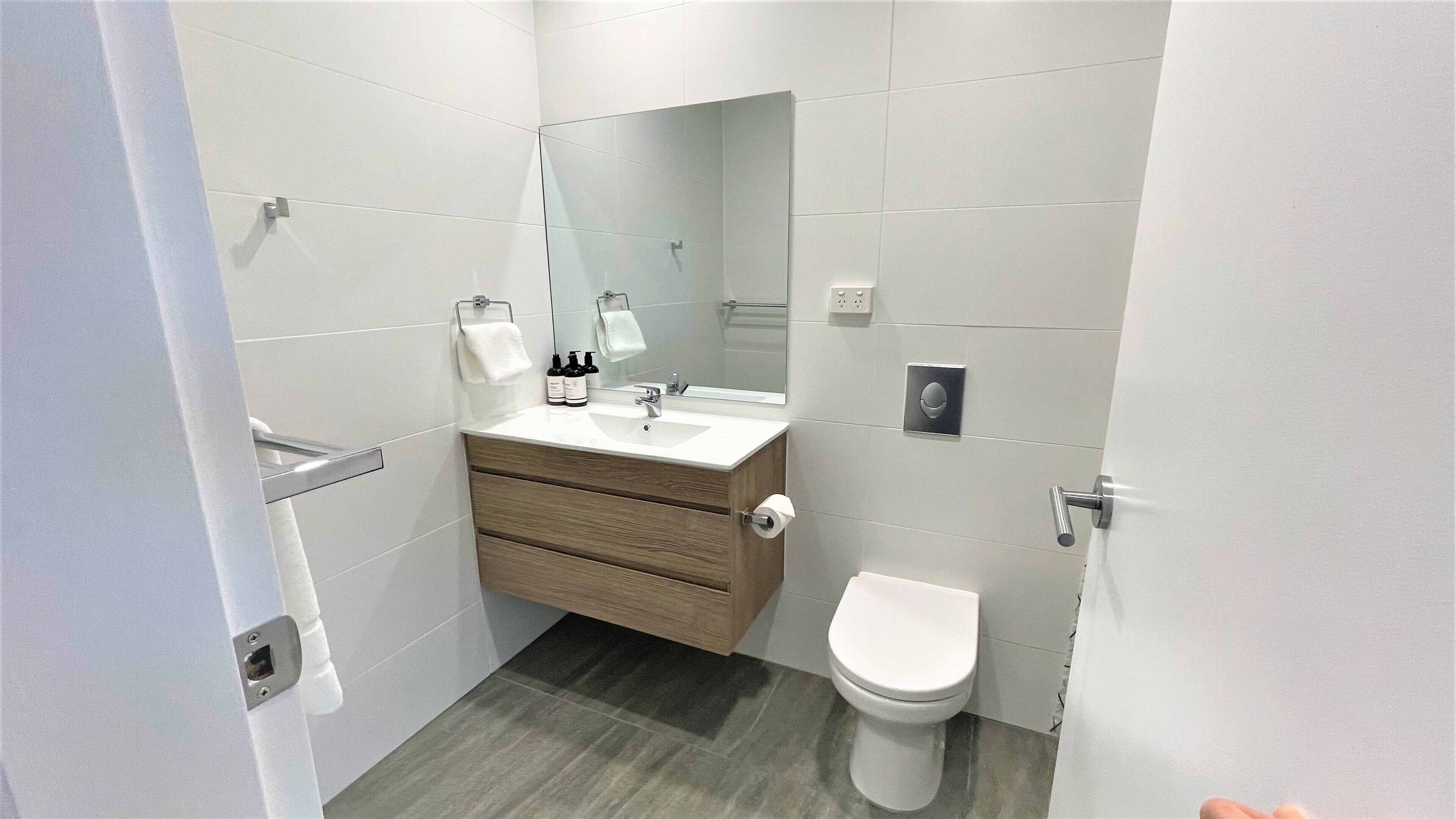 lakeview family room | bathroom | shower, hair dryer, towels, soap