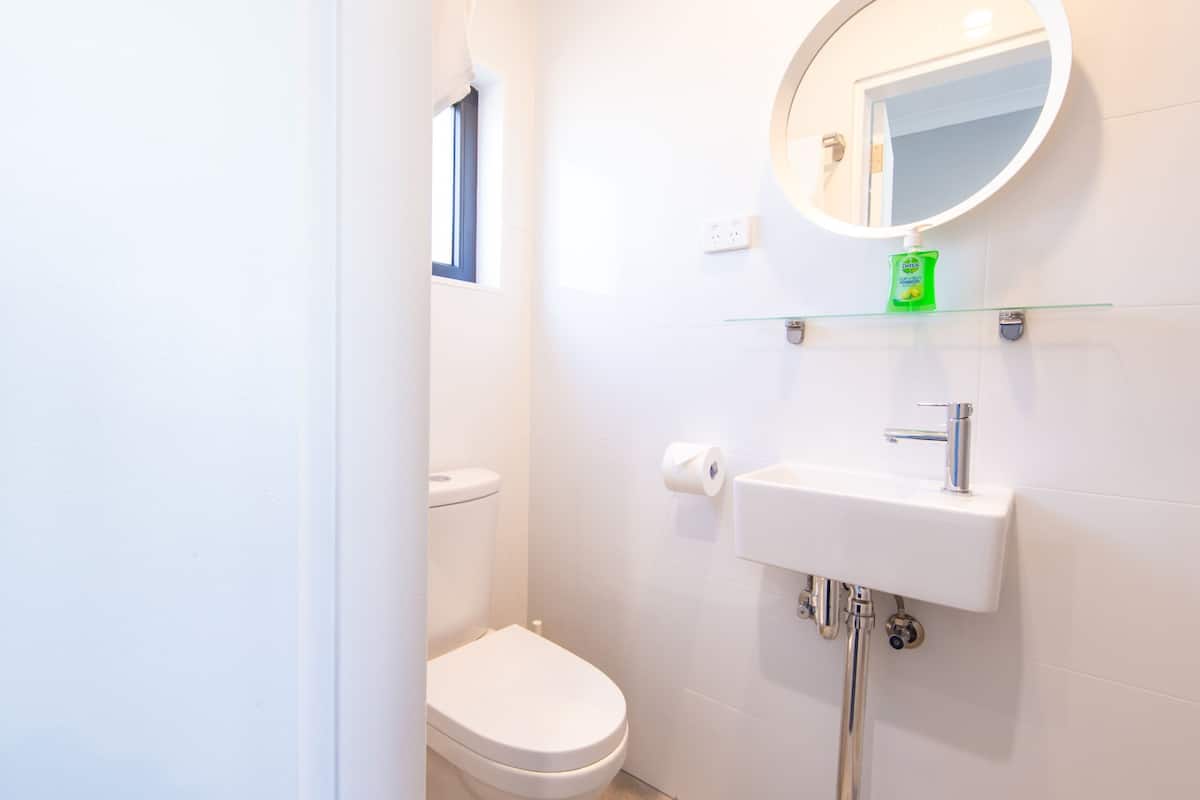 deluxe family room | bathroom | shower, hair dryer, towels, soap