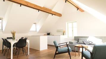 Superior Apartment, River View | Living area | Flat-screen TV