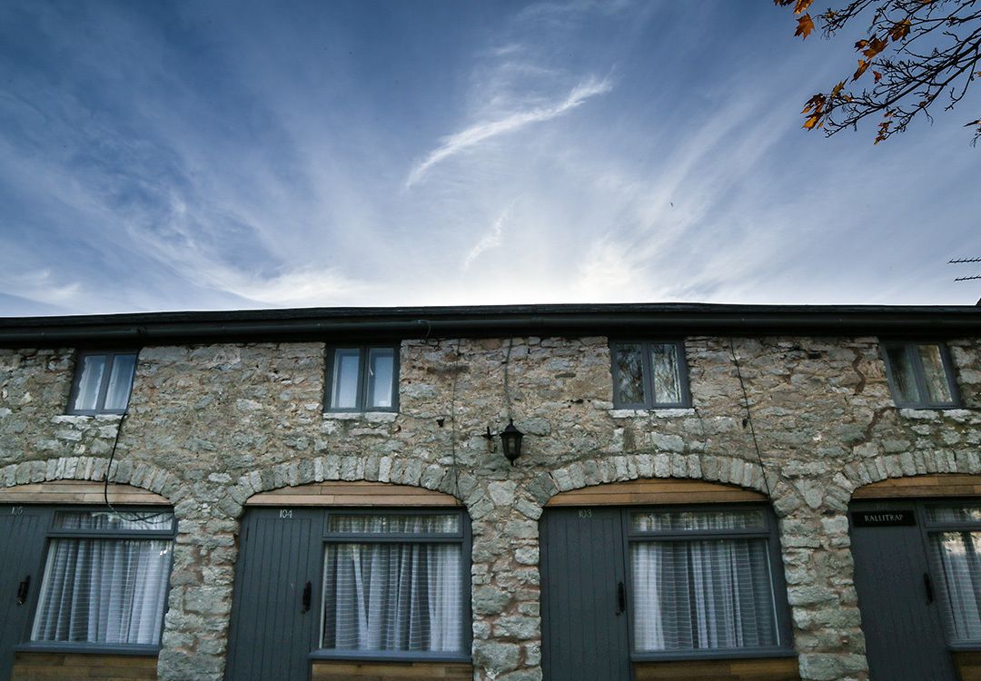 A stone building with three arched windows and a door labeled "RALLITZA".