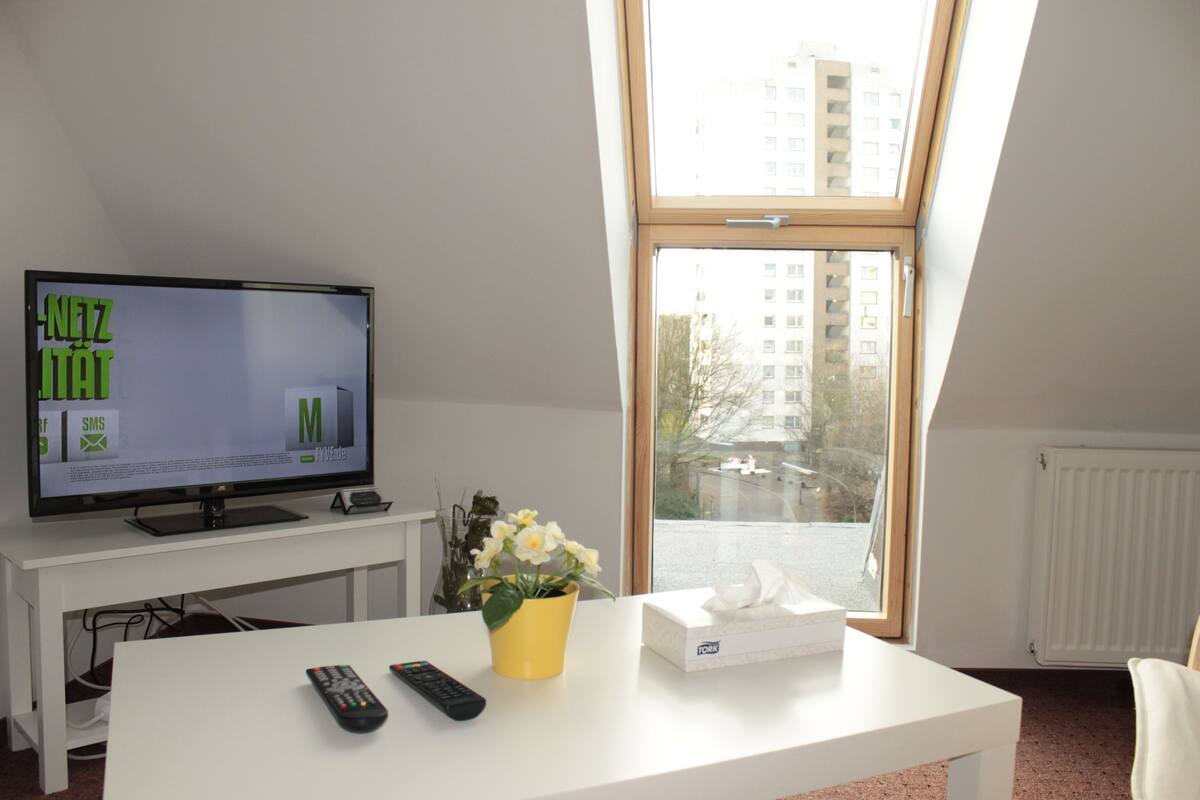Standard Studio, 3 Single Beds, Garden View | Living room | Flat-screen TV