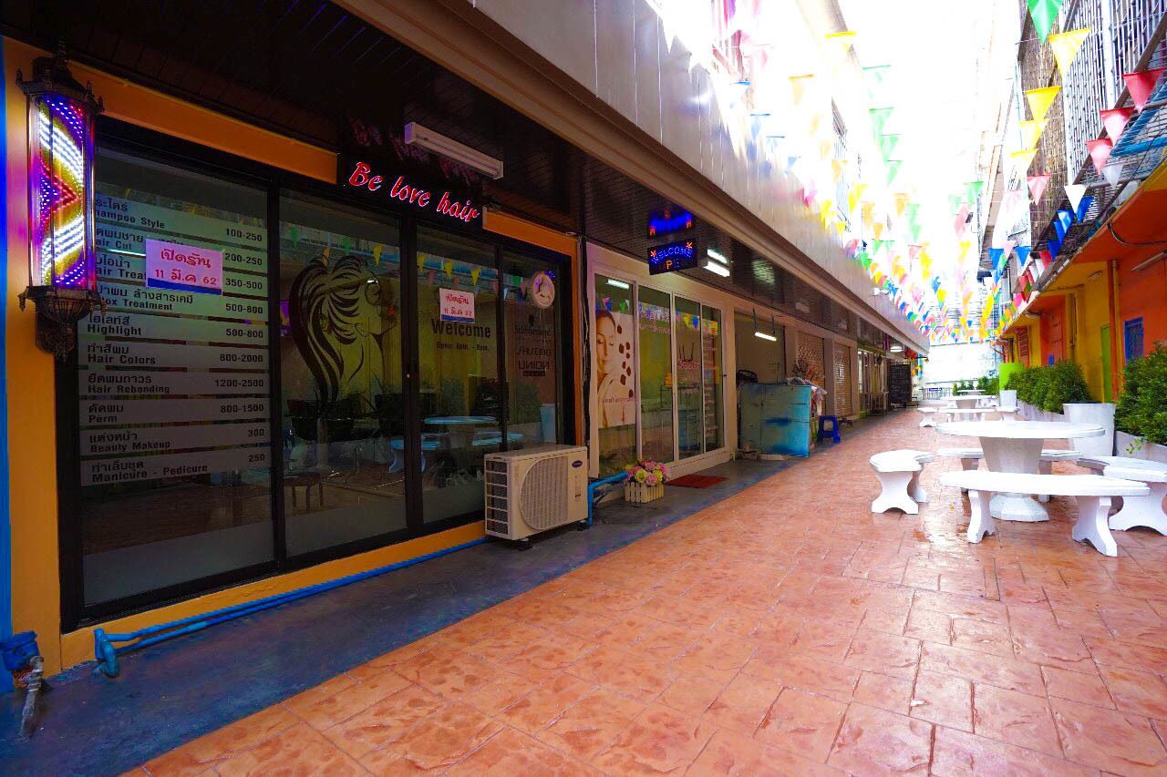 A hair salon with a menu board and a sign that reads "Be love hair". - Plu Garden Villa (Bangkok)
