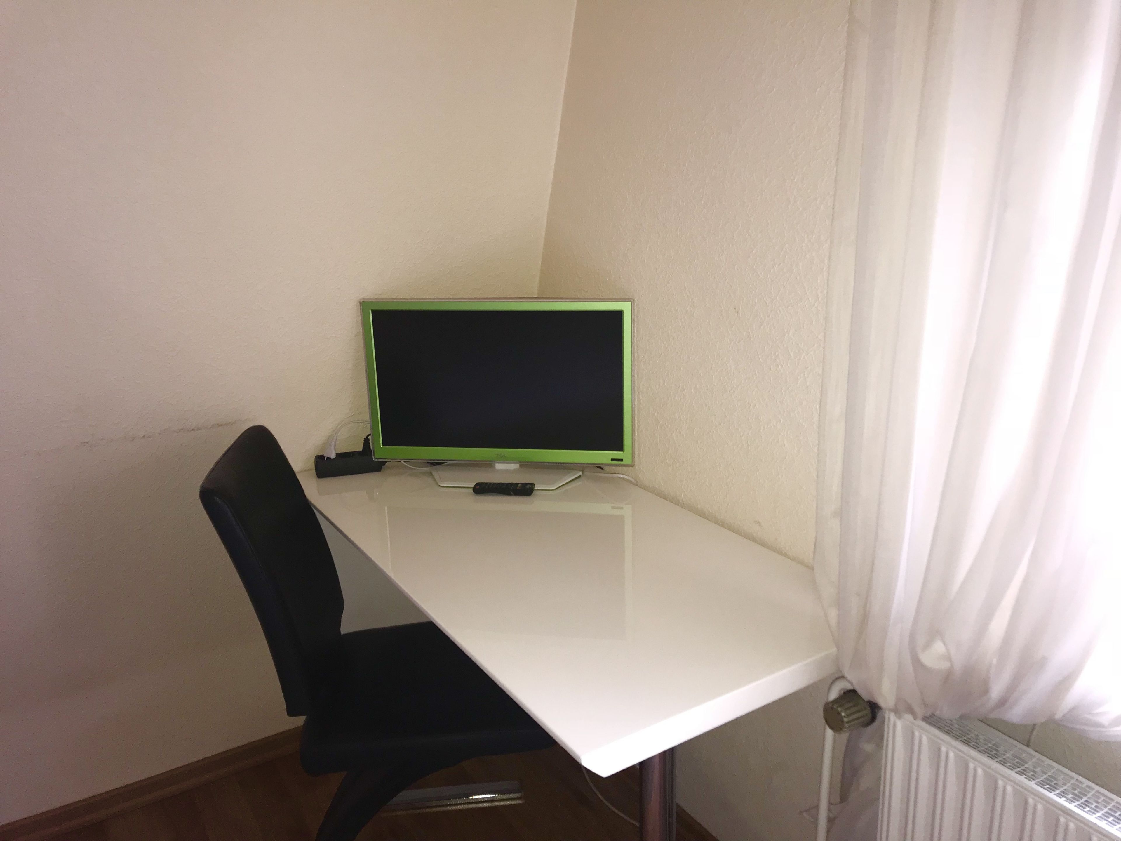 economy single room, private bathroom | television