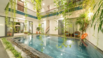 Indoor pool, open 7:30 AM to 9:00 PM, pool umbrellas