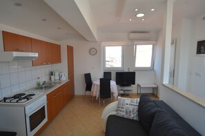 Appartamento, 1 camera da letto | Cucina privata | Frigorifero, forno, piano cottura, macchina per tè/caffè
