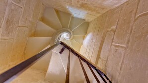 A spiral staircase with a handrail and steps leading upwards. - Traditional Maltese Townhouse, Roof Terrace and Views (Senglea)