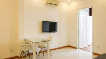 Deluxe Apartment, 1 Bedroom | Living area | Flat-screen TV