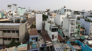 A densely packed urban area with various buildings, including residential and commercial structures.