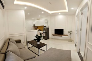 Deluxe Apartment, 2 Bedrooms | Living area | TV