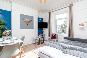 Enjoy a meal for two in the dining area, relax on the sofa, or take in the view from the large window.