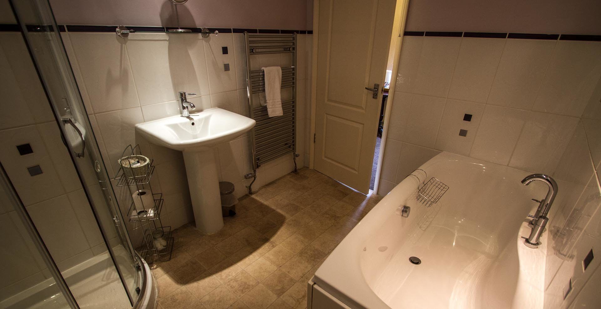superior double room | bathroom | free toiletries, hair dryer, towels
