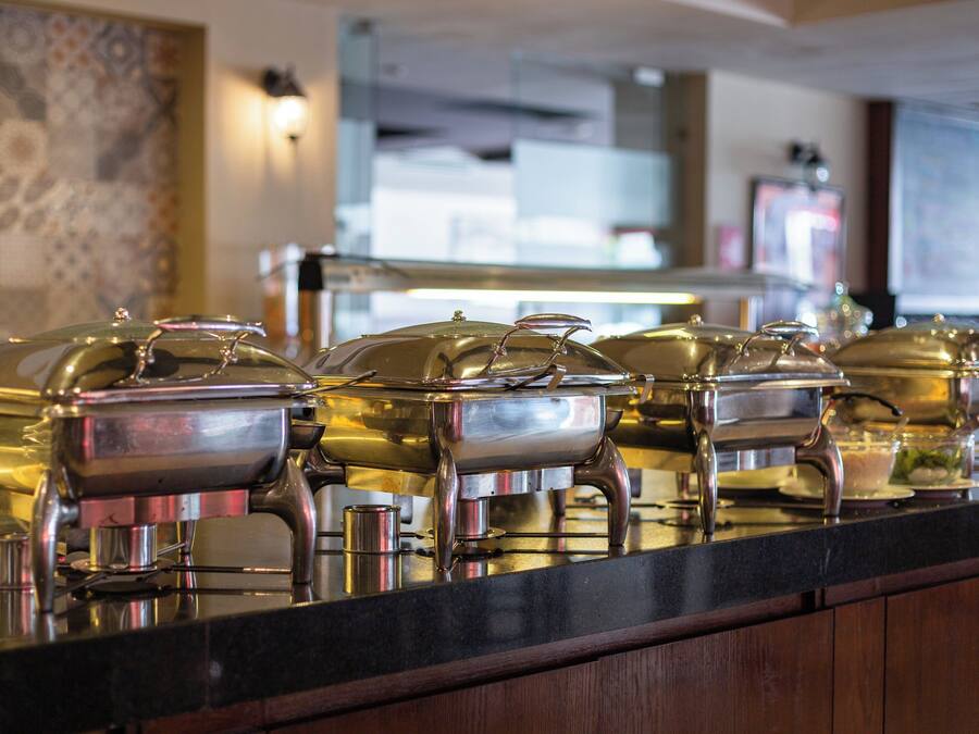 A buffet area with multiple self-service food stations.