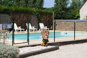 Seasonal outdoor pool, open 9:00 AM to 8:30 PM, pool umbrellas