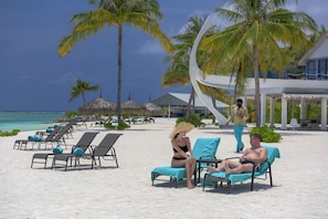 On the beach, white sand, free beach cabanas, sun loungers