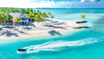On the beach, white sand, free beach cabanas, sun-loungers
