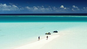 On the beach, white sand, free beach cabanas, sun-loungers