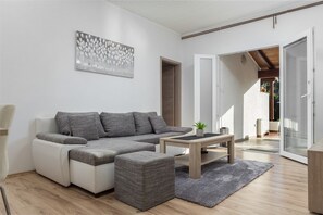 Apartment, Mehrere Betten | Wohnzimmer
