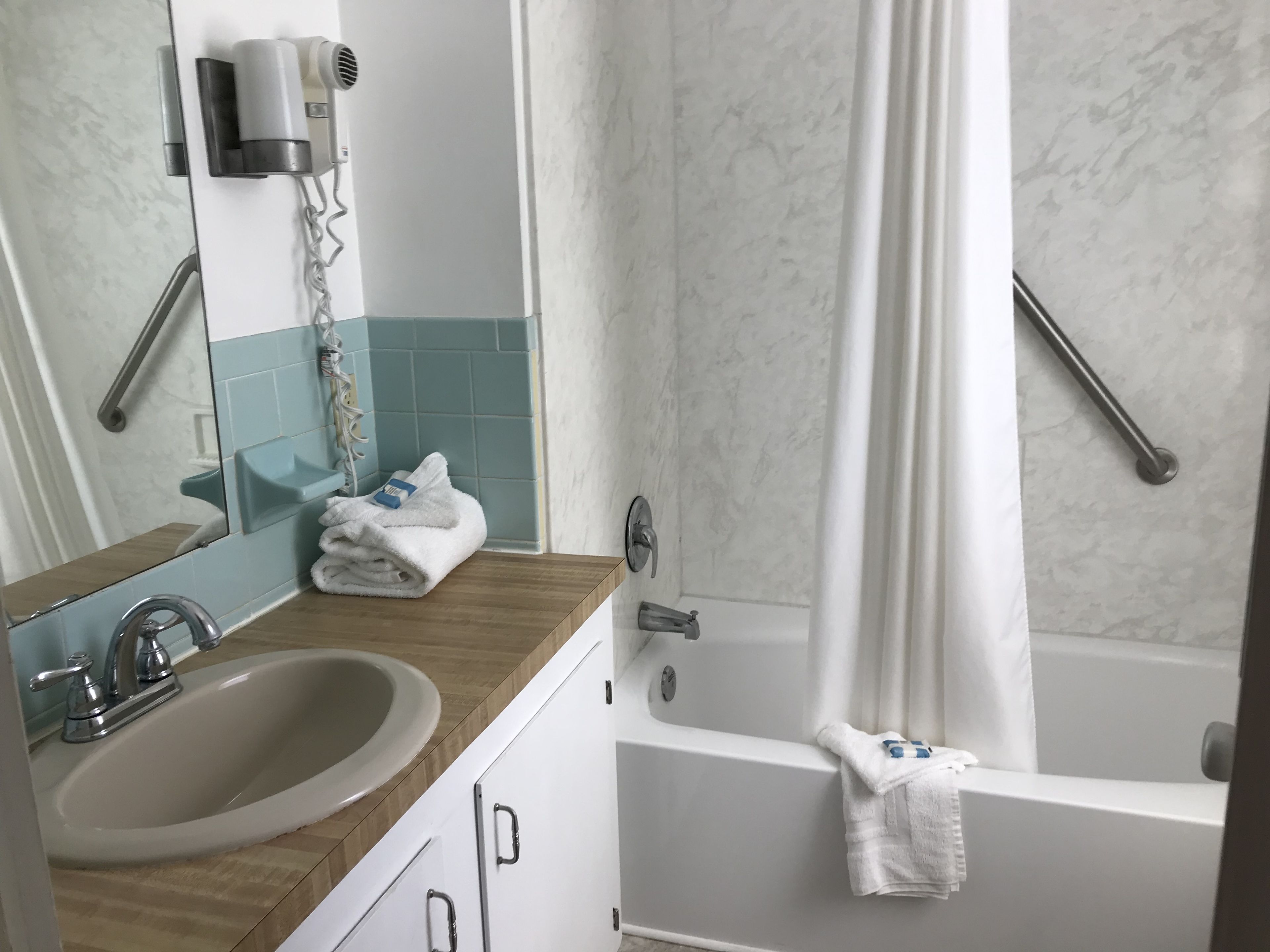 2 queen beds, poolside | bathroom | combined shower/bathtub, towels