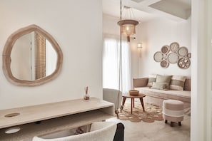 Grande Suite | Living area | 42-inch Smart TV with satellite channels, TV, Netflix - Volcano Luxury Suites Milos - Adults Only (Milos)