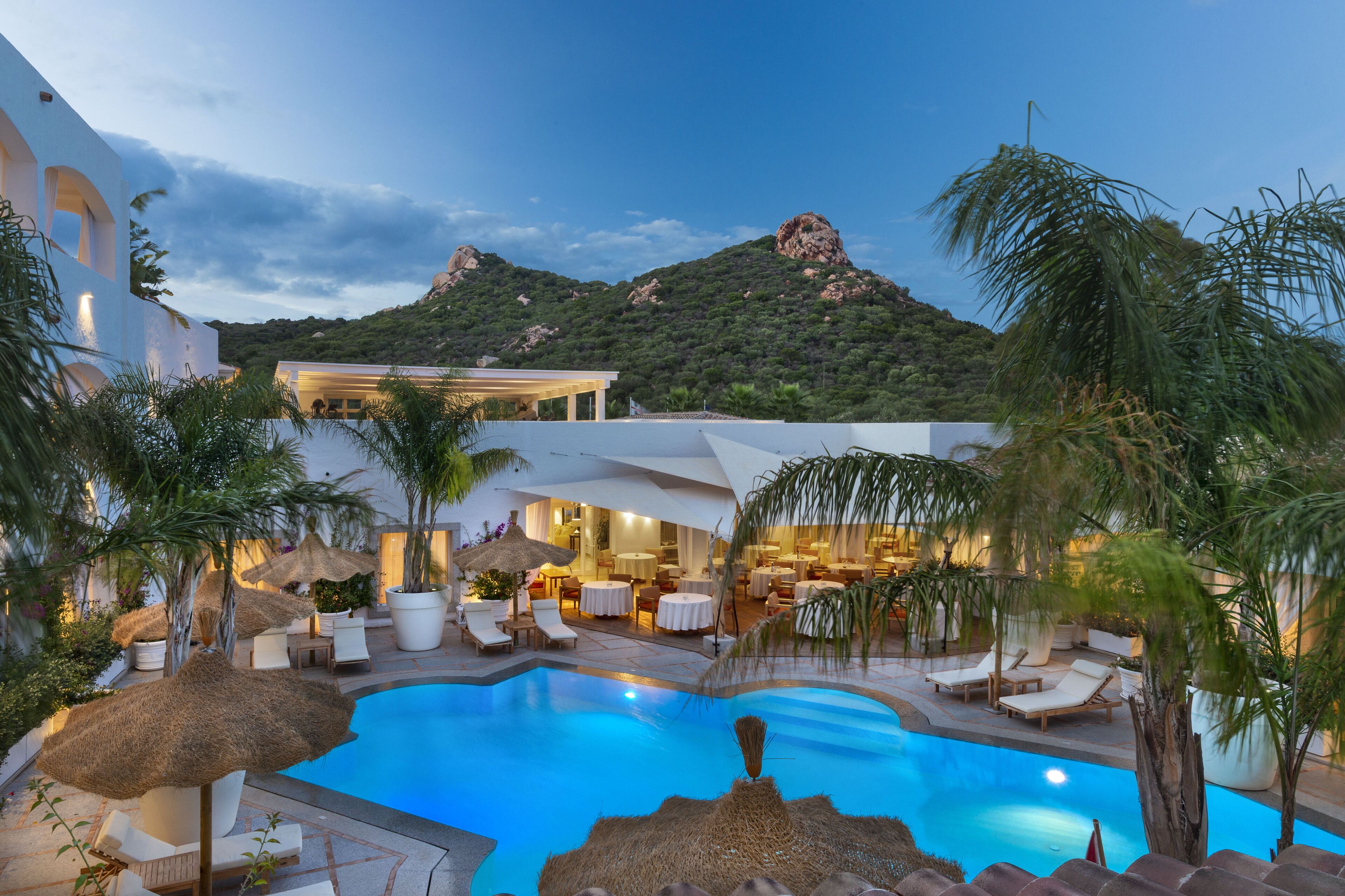 Outdoor pool, open 10:00 AM to 7:00 PM, pool umbrellas, pool loungers