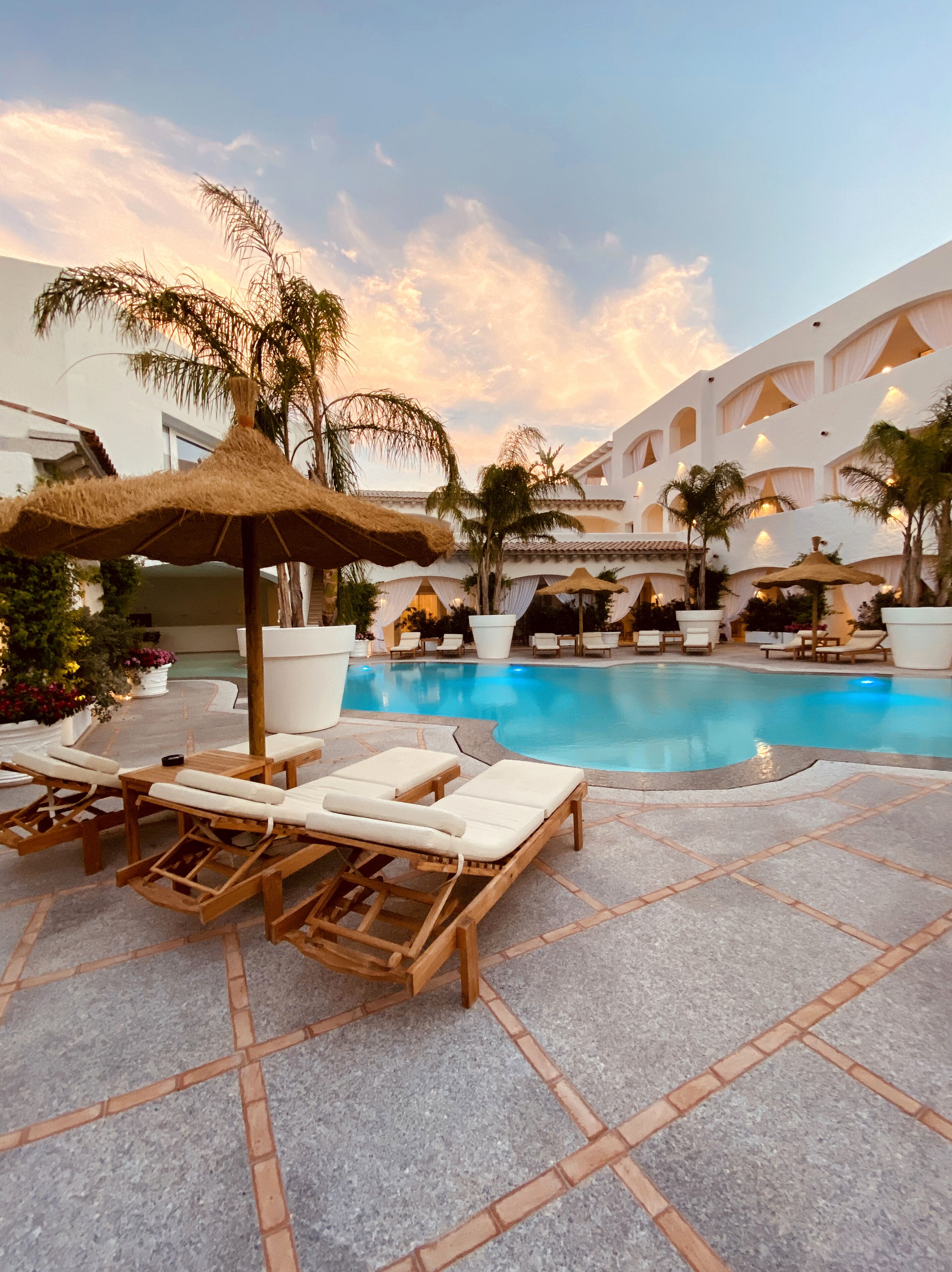 outdoor pool, open 10:00 am to 7:00 pm, pool umbrellas, pool loungers