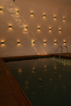 Indoor pool, open 9:00 AM to 8:00 PM, pool loungers
