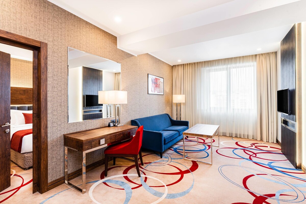 Superior Suite, 2 Bedrooms (1 King Bed, 2 Single Beds) | Minibar, in-room safe, desk, laptop workspace