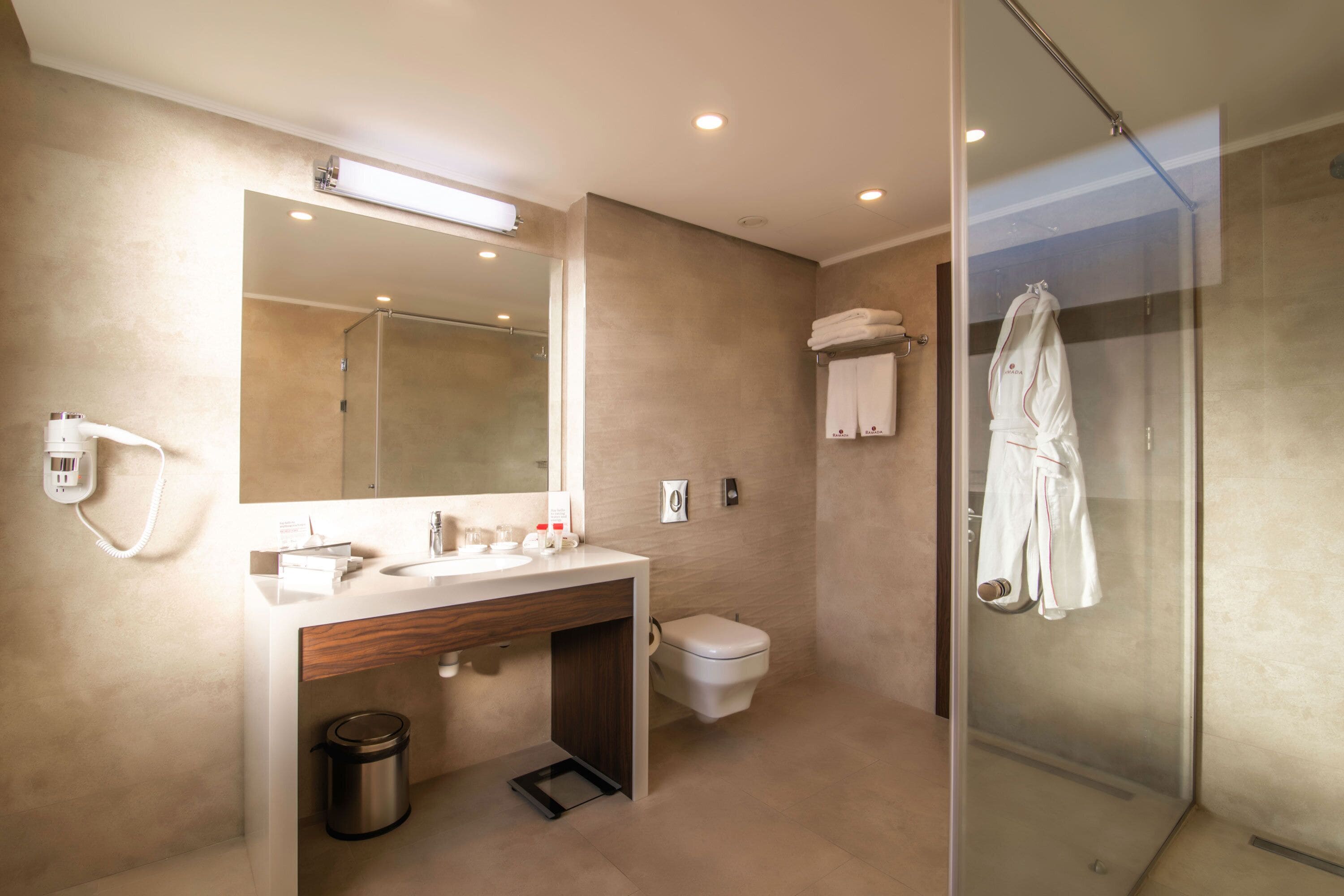 junior suite, 1 king bed | bathroom | hair dryer, towels