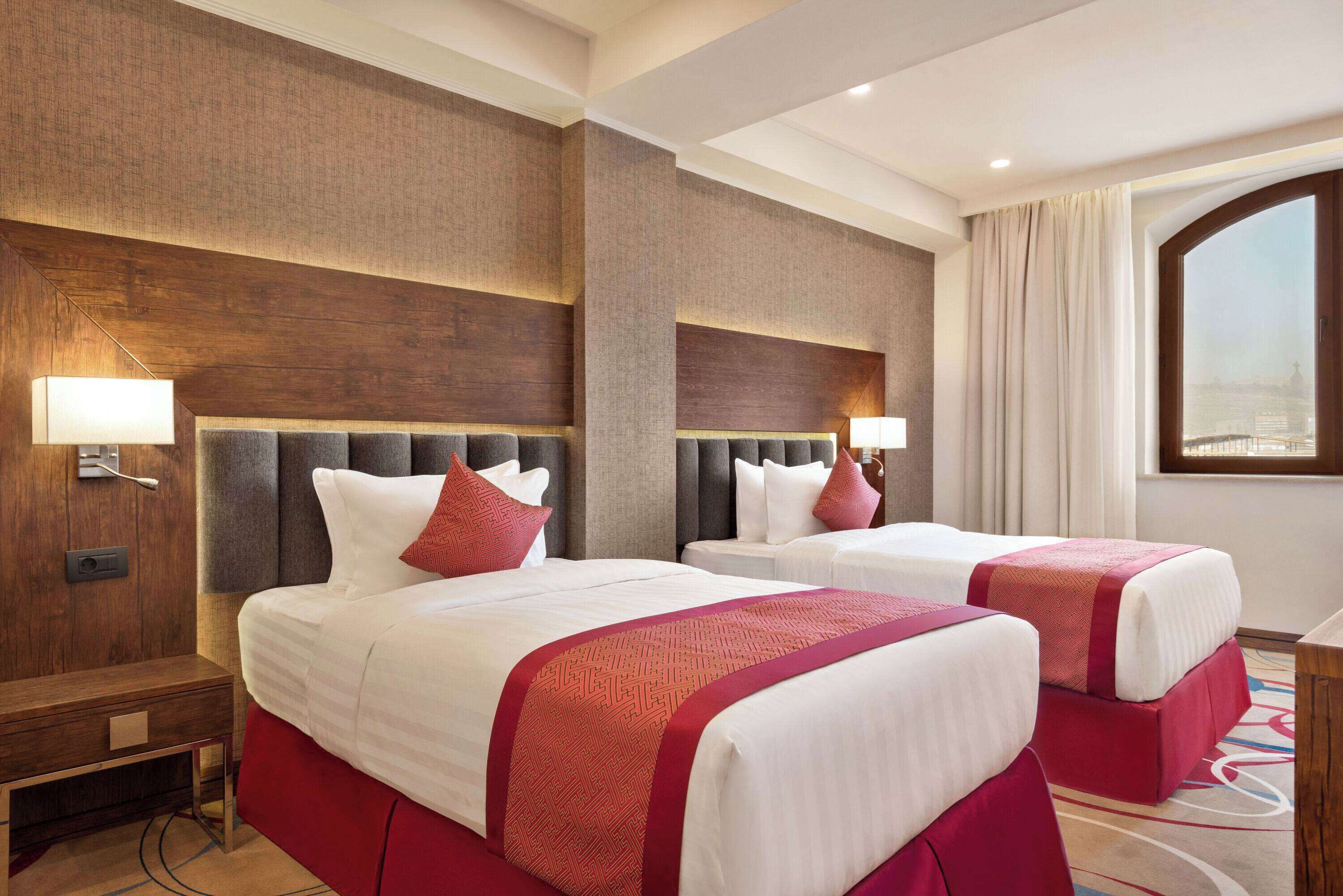 superior suite, 2 bedrooms (1 king bed, 2 single beds) | minibar, in-room safe, desk, laptop workspace