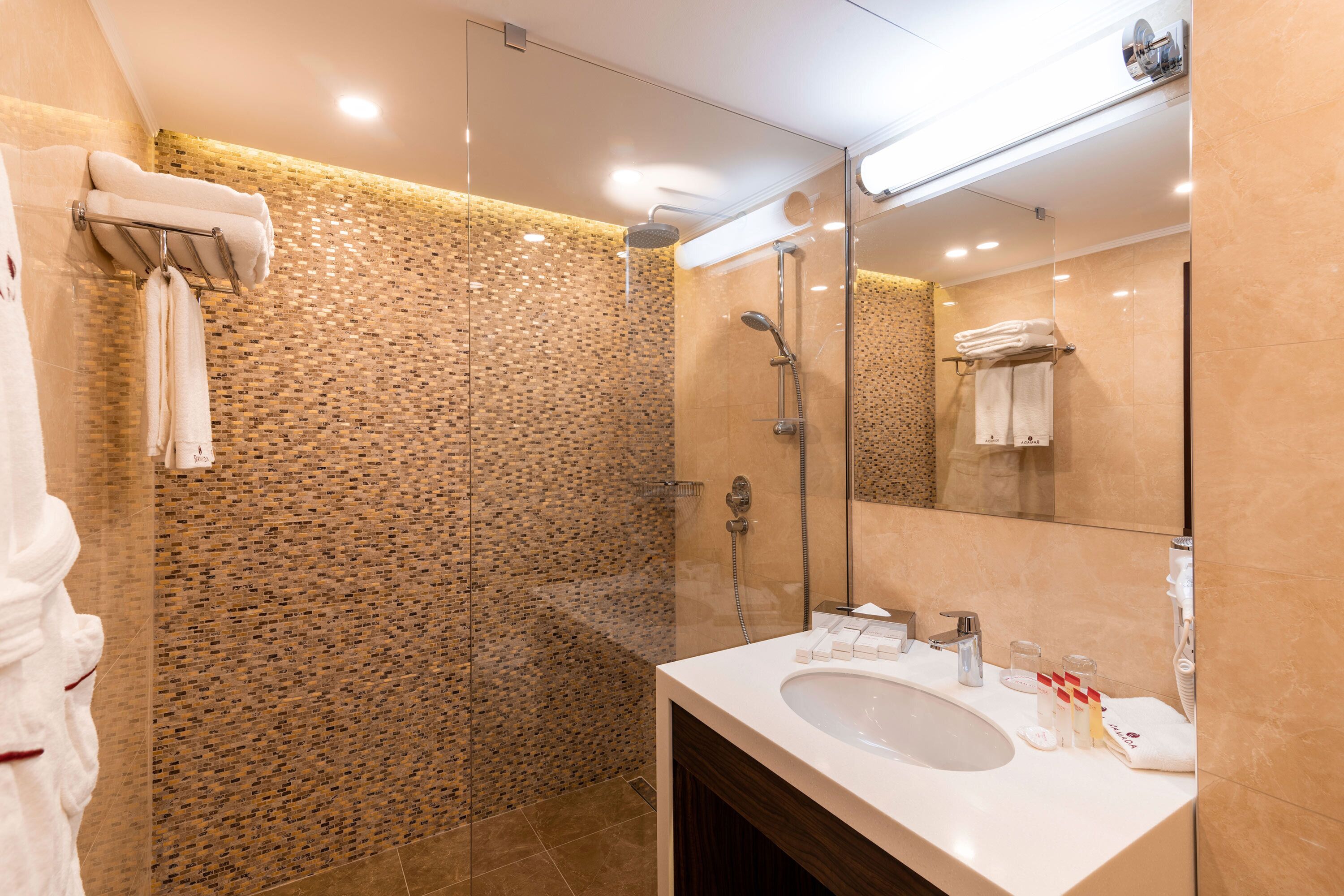 suite, 1 king bed | bathroom | hair dryer, towels