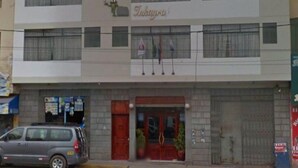 A multi-story building with a sign reading "Tukaya". - inkayra hotel (Cusco)