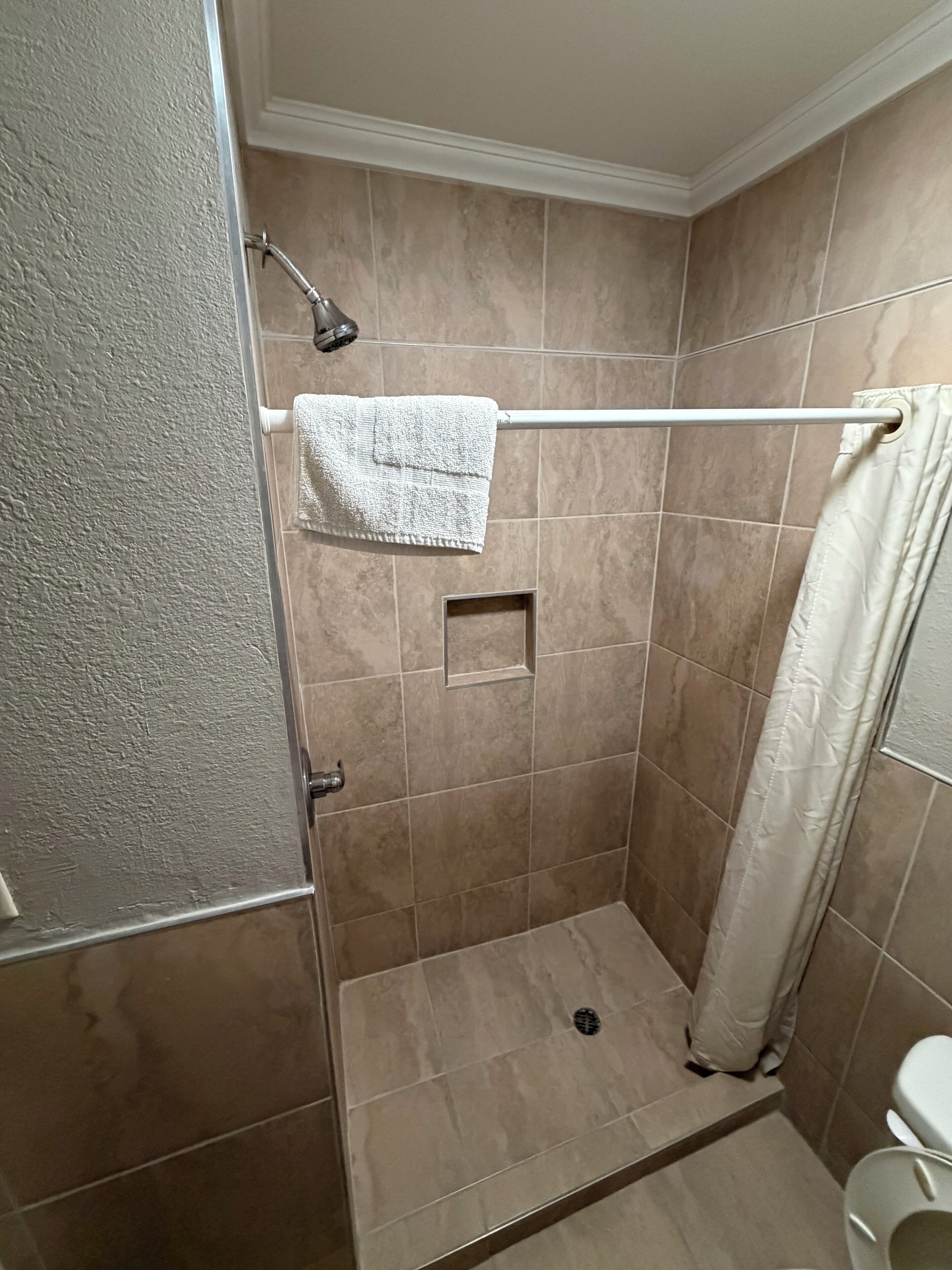 Deluxe Room, 1 King Bed | Bathroom | Jetted tub, rainfall showerhead, towels