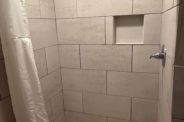 Jetted tub, rainfall showerhead, towels