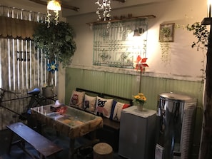 Romantic Quadruple Room, 2 Double Beds (Jungle) | Living room | 50-inch LCD TV with cable channels, TV