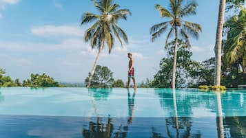 Outdoor pool, open 7:00 AM to 8:00 PM, pool loungers