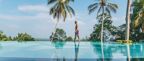 Outdoor pool, open 7:00 AM to 8:00 PM, pool loungers