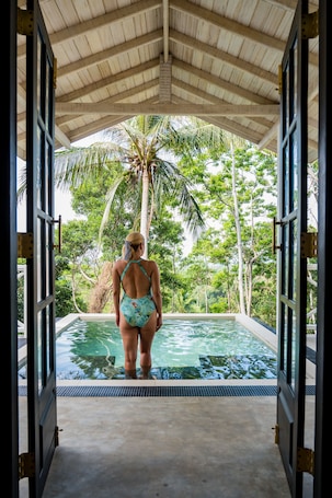 Outdoor pool, open 7:00 AM to 8:00 PM, pool loungers