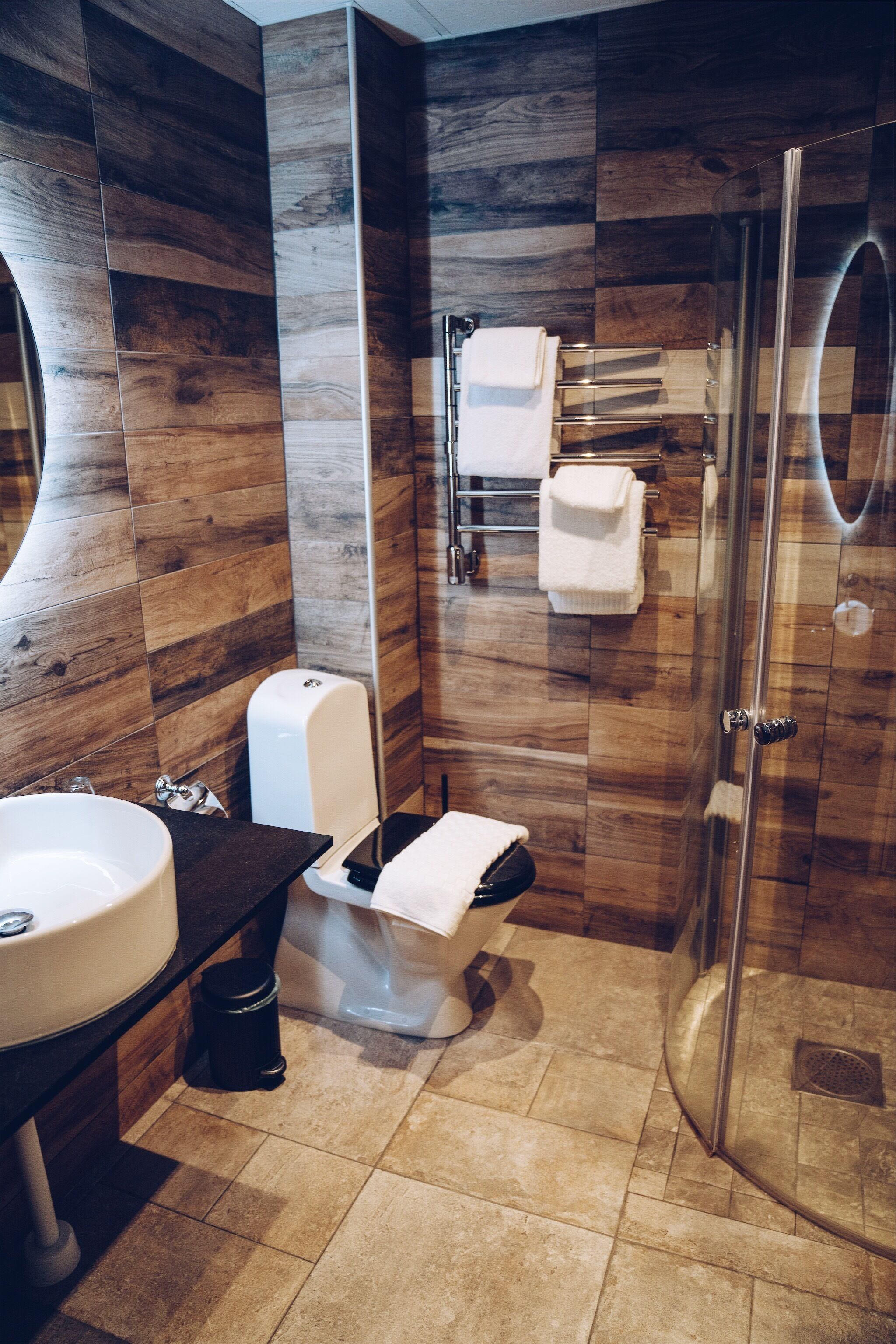 designer toiletries, hair dryer, bathrobes, slippers