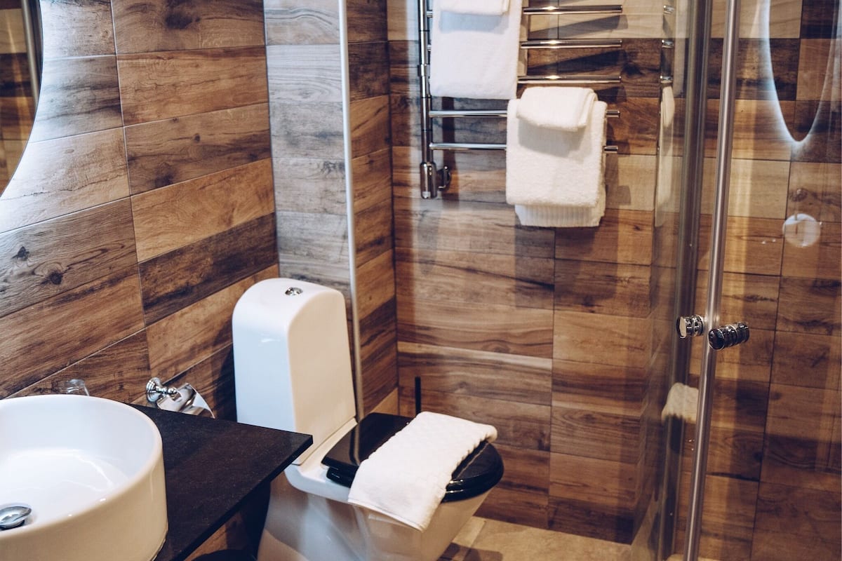 designer toiletries, hair dryer, bathrobes, slippers