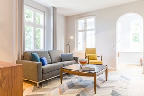 One-bedroom apartment | Living area | 40-inch flat-screen TV with cable channels, TV