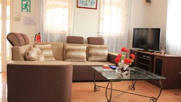 Standard Apartment, Multiple Beds, Terrace | Living area | Flat-screen TV