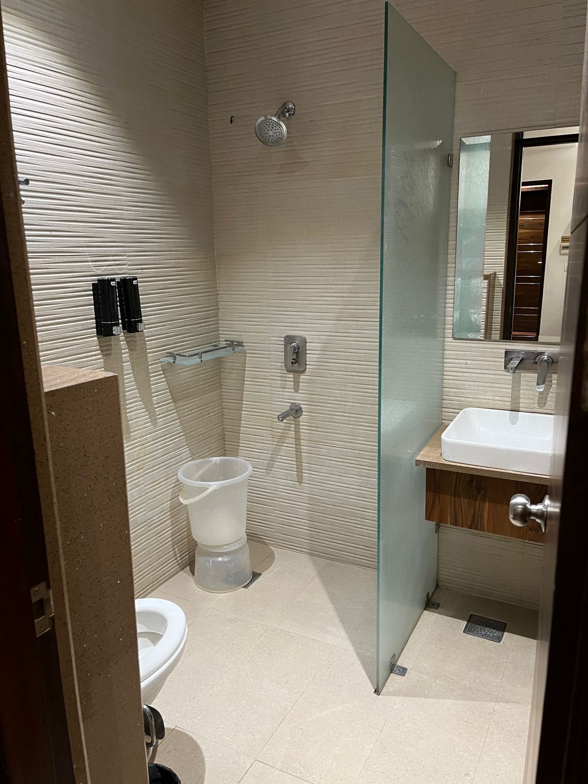 shower, rainfall showerhead, slippers, towels