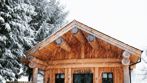 A wooden cabin with a porch and a door labeled "LOFT & BAR." - Braisty Woods - Hopes & Beams (Harrogate)
