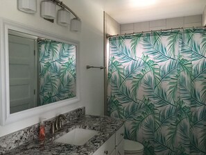 Combined shower/bathtub, hair dryer, towels, soap