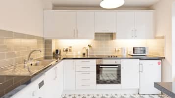 Comfort Apartment, 2 Bedrooms | Private kitchen | Full-sized fridge, microwave, oven, stovetop