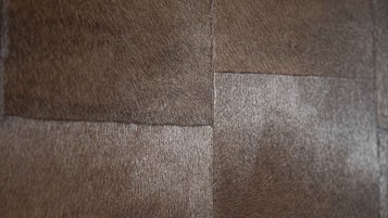 A close-up of a textured wall with a vertical seam.