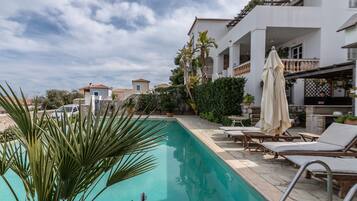 Outdoor pool, pool umbrellas, pool loungers