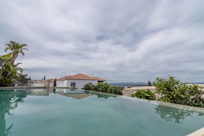 Outdoor pool, pool umbrellas, pool loungers