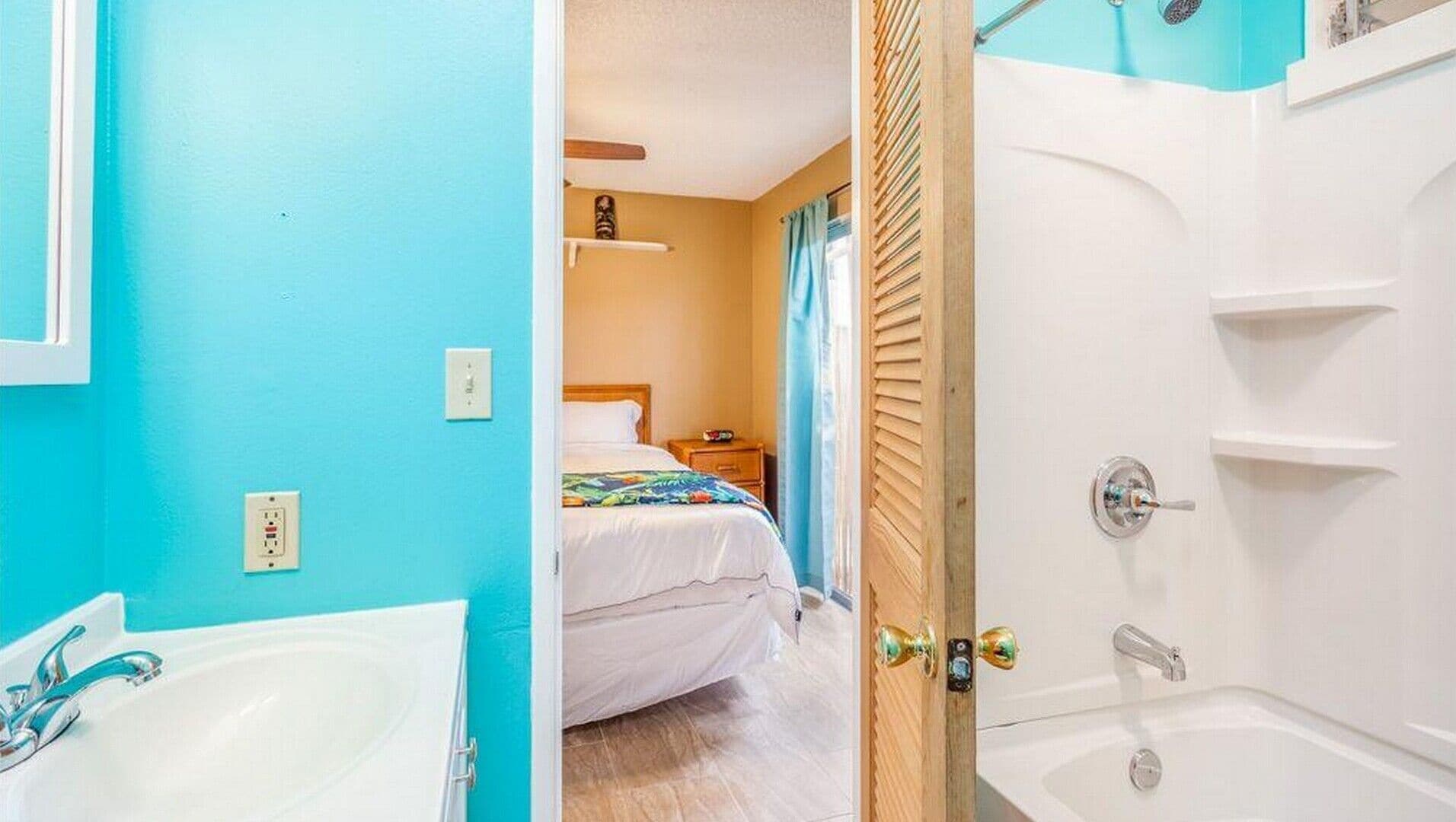 A bathroom with a bathtub, a sink, and a shower.